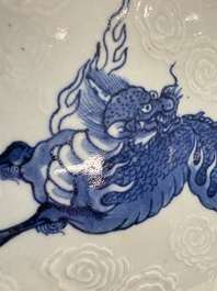 A Japanese Arita blue and white Kakiemon-style 'Kirin' plate with underglaze relief design, Edo, 18th C.