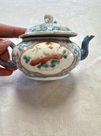 Three Chinese famille rose blue- and yellow-ground teapots and covers for the Straits or Peranakan market, Tongzhi marks, 19th C.