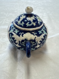 Three Chinese famille rose blue- and yellow-ground teapots and covers for the Straits or Peranakan market, Tongzhi marks, 19th C.