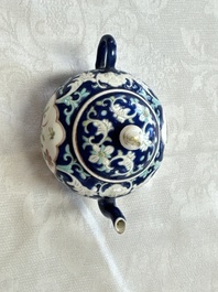 Three Chinese famille rose blue- and yellow-ground teapots and covers for the Straits or Peranakan market, Tongzhi marks, 19th C.