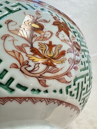 A Chinese famille verte relief-carved bowl with gilt iron-red floral design, Kangxi