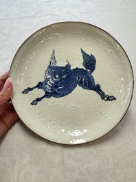 A Japanese Arita blue and white Kakiemon-style 'Kirin' plate with underglaze relief design, Edo, 18th C.