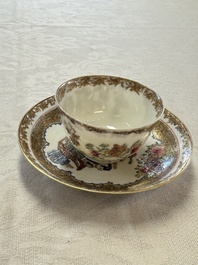 A fine Chinese Canton famille rose gilt-decorated cup and saucer with figural design, Yongzheng/Qianlong
