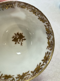 A fine Chinese Canton famille rose gilt-decorated cup and saucer with figural design, Yongzheng/Qianlong