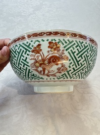 A Chinese famille verte relief-carved bowl with gilt iron-red floral design, Kangxi