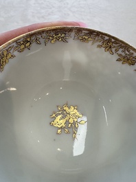 A fine Chinese Canton famille rose gilt-decorated cup and saucer with figural design, Yongzheng/Qianlong