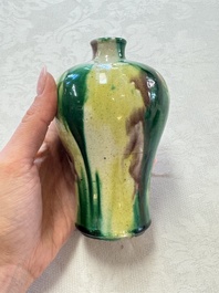 A Chinese sancai-glazed 'Meiping' vase on a wooden stand, 19th C.