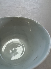 A Chinese white-glazed cup on a wooden stand, 17th C.