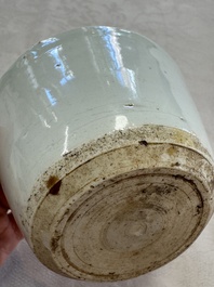 A Chinese white-glazed cup on a wooden stand, 17th C.