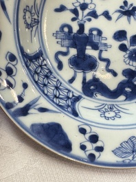 Six Chinese blue and white plates, a dish and a large tile, Yongzheng/Qianlong