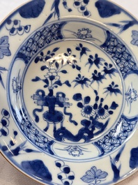 Six Chinese blue and white plates, a dish and a large tile, Yongzheng/Qianlong