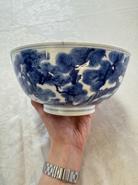 A Chinese blue and white bowl with scholars among cranes and deer, Kangxi mark and of the period