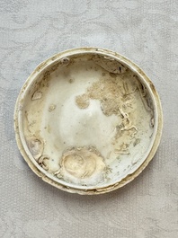 Four Chinese white-glazed boxes and covers with incised floral design from the Jepara shipwreck, Dehua or Anxi kiln, Song
