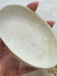 Four Chinese white-glazed boxes and covers with incised floral design from the Jepara shipwreck, Dehua or Anxi kiln, Song