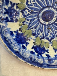 A Persian blue, white, and green glazed dish with stylised floral design, Safavid, 17/18th C.