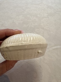 Four Chinese white-glazed boxes and covers with incised floral design from the Jepara shipwreck, Dehua or Anxi kiln, Song
