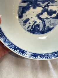 A Chinese blue and white bowl with scholars among cranes and deer, Kangxi mark and of the period