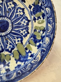A Persian blue, white, and green glazed dish with stylised floral design, Safavid, 17/18th C.