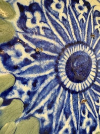 A Persian blue, white, and green glazed dish with stylised floral design, Safavid, 17/18th C.