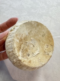 Four Chinese white-glazed boxes and covers with incised floral design from the Jepara shipwreck, Dehua or Anxi kiln, Song
