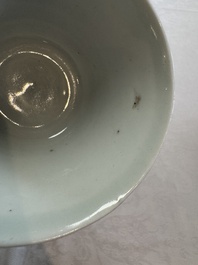 A Chinese white-glazed cup on a wooden stand, 17th C.