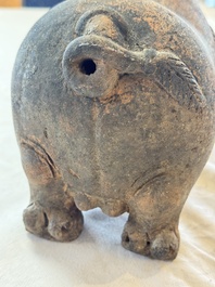 A Javanese terracotta boar-shaped money bank, probably Majapahit Kingdom, 15th C.