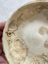 Four Chinese white-glazed boxes and covers with incised floral design from the Jepara shipwreck, Dehua or Anxi kiln, Song