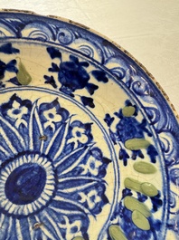 A Persian blue, white, and green glazed dish with stylised floral design, Safavid, 17/18th C.