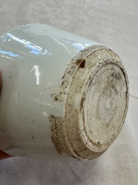 A Chinese white-glazed cup on a wooden stand, 17th C.