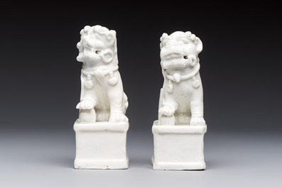 Two Chinese Dehua blanc-de-Chine Buddhist lions, three famille rose figures, and a white-glazed group, Kangxi and later