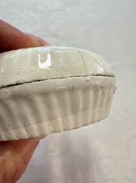 Four Chinese white-glazed boxes and covers with incised floral design from the Jepara shipwreck, Dehua or Anxi kiln, Song