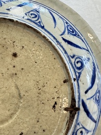 A Persian blue, white, and green glazed dish with stylised floral design, Safavid, 17/18th C.