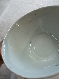 A Chinese white-glazed cup on a wooden stand, 17th C.