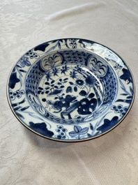 Six Chinese blue and white plates, a dish and a large tile, Yongzheng/Qianlong