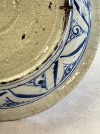 A Persian blue, white, and green glazed dish with stylised floral design, Safavid, 17/18th C.