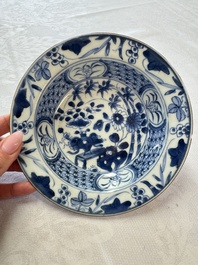 Six Chinese blue and white plates, a dish and a large tile, Yongzheng/Qianlong