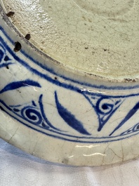A Persian blue, white, and green glazed dish with stylised floral design, Safavid, 17/18th C.