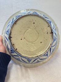 A Persian blue, white, and green glazed dish with stylised floral design, Safavid, 17/18th C.