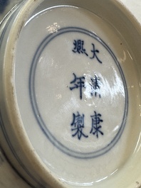 A Chinese blue and white bowl with scholars among cranes and deer, Kangxi mark and of the period