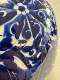 A pair of Chinese blue and white 'Lotus Scroll' jars, 19th C.