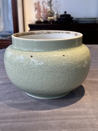 A Chinese celadon-glazed bowl with incised chilong among floral scrolls, Kangxi