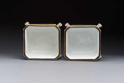 A pair of French gilt blue-ground 'Cherub' jardini&egrave;res with biscuit-relief plaques, 19/20th C.
