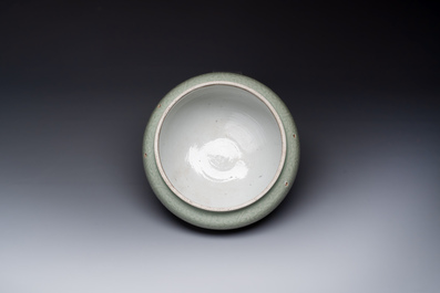 A Chinese celadon-glazed bowl with incised chilong among floral scrolls, Kangxi