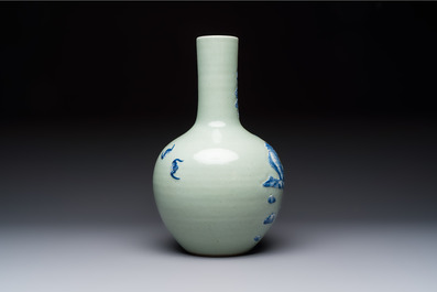A Chinese blue and white celadon-ground 'Sanxing' bottle vase with relief design, 19th C.