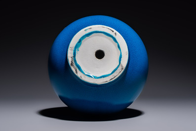 A Japanese Awaji orange-glazed brush washer, marked, and a blue-glazed vase, 19/20th C.