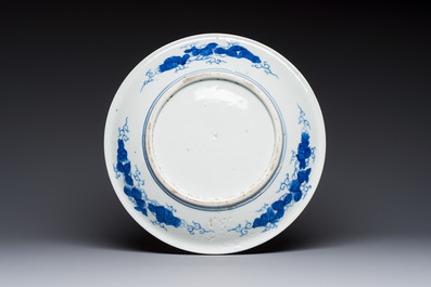 A Japanese blue and white dish with narrative design, Meiji, 19th C.