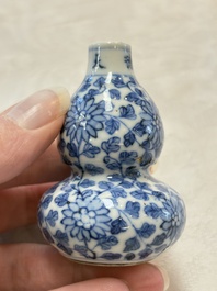 A Chinese blue and white double-gourd snuff bottle and a huali snuff bottle, Xuande and Qianlong mark, 19th C.