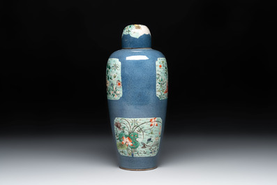 A Chinese famille verte powder-blue-ground 'Fish and Bird' vase and cover, 19th C.