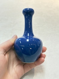 Three Chinese blue-glazed miniature vases on wooden stands and a claire-de-lune seal paste box and cover, 19th C.