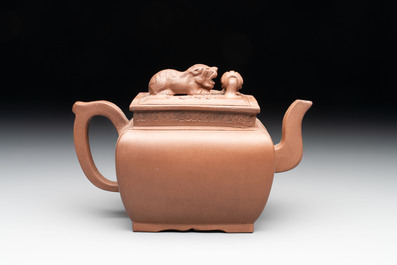 A Chinese Yixing stoneware 'lion and brocade ball' teapot and cover, 19/20th C.